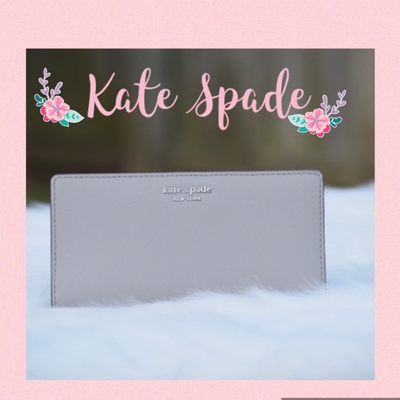 kate spade Handbags - Kate Spade large slim bifold wallet Grey